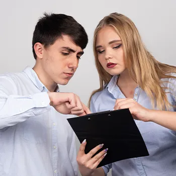 Two business partners reading