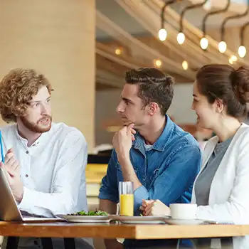 Three people having business conversation