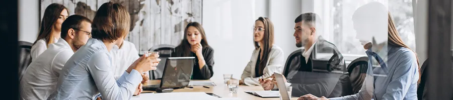 A wide group of people in a corporate office