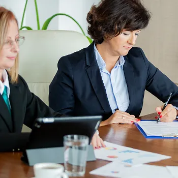 Two businesswoman focused on working