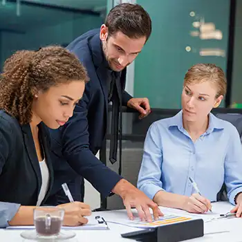 A manager teaching his colleagues