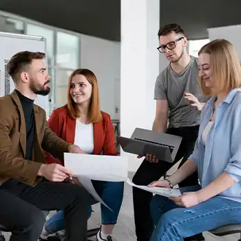 A group of coworkers having a conversation