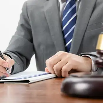 A lawyer writing on a document