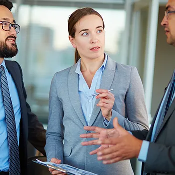 Discussion between three business person