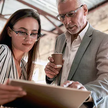 An old businessman teaching a new member