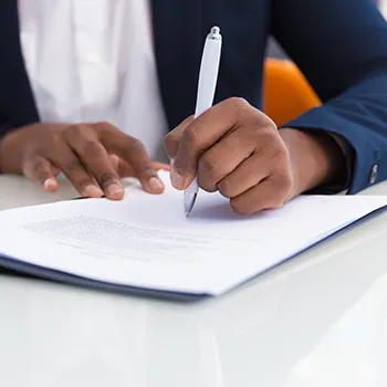 A businessman filling up a form