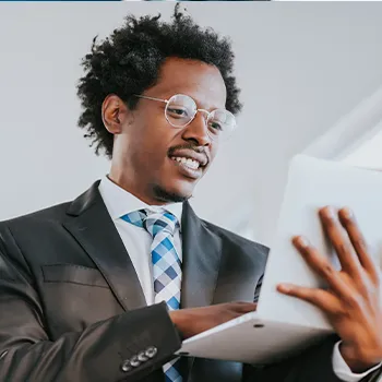 Venture Smarter | LLC vs Incorporation | What's the Difference? A man reading a document about types of corporations