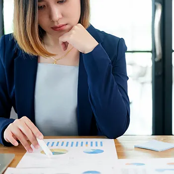 A woman reading about benefits of PLLCs