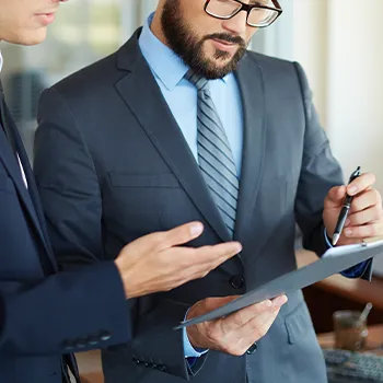 Two employees signing a paper for starting an limited liability company in Pennsylvania