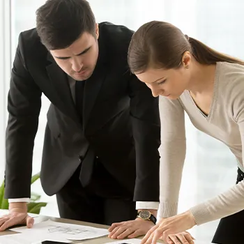 Venture Smarter | What is an LLC Registered Agent? (The Complete Guide) Two different agent planning on a piece of paper