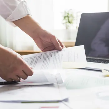 A man organizing documents for an Arkansas LLC