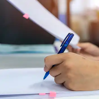 A man organizing a document for creating LLC Idaho