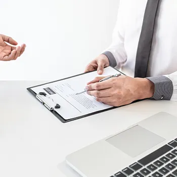 A man filling out a document for an Arizona LLC