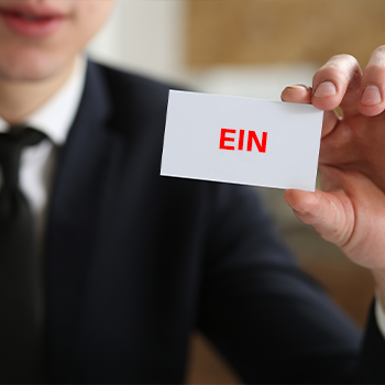 man showing a EIN card