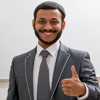 man in formal wearing with his thumbs up