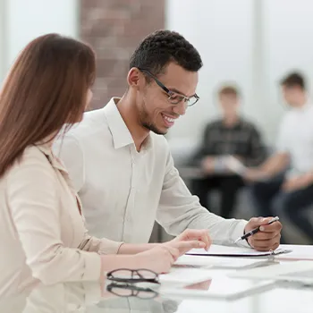 man and woman in an office table