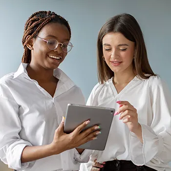 Businesswomen looking at a tablet