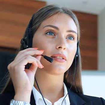 A woman inside an office talking to someone about creating an llc in indiana