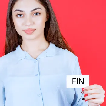 Woman holding a white card