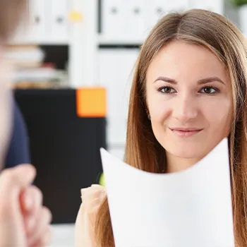 Woman holding files passing to someone