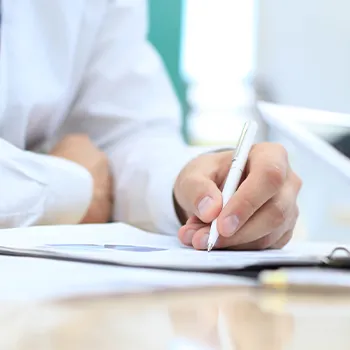 A man signing a paper for a limited liability company