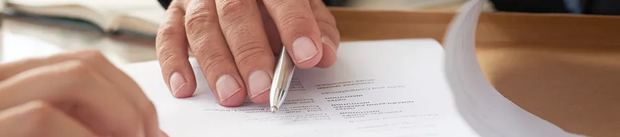 Venture Smarter | How to Transfer an LLC to Another State? (In 6 Easy Steps) Reviewing an important document about moving an LLLC to another state