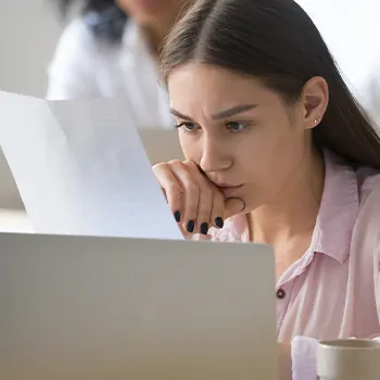 Serious woman working on her table