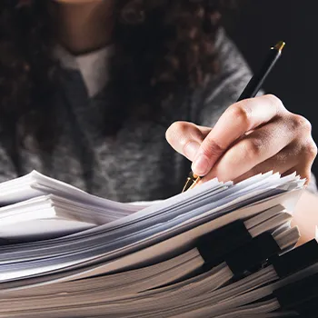 A woman filing documents for multiple DBAs in LLC