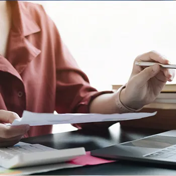 A woman holding a piece of paper