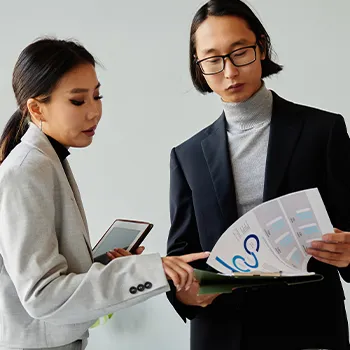 Two business person having discussion with each other