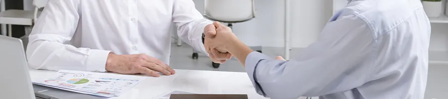 Shaking hands with another person