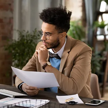 Man thinking seriously in his desk