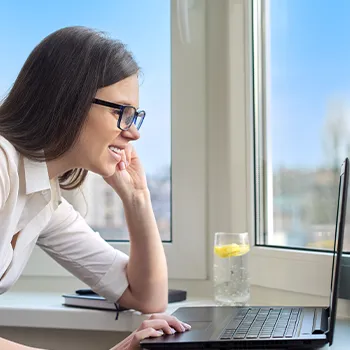 Woman looking up something on her laptop