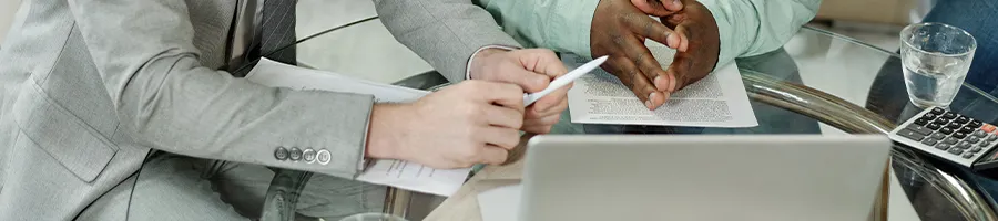 Close up image of workers busy compiling files