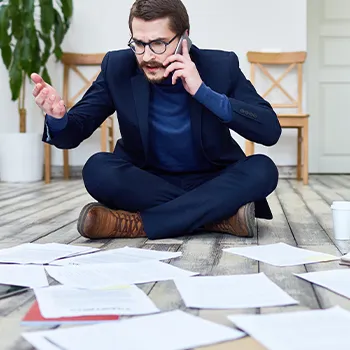 Stressed person working on his office floor