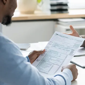 Man reviewing and checking his answered forms