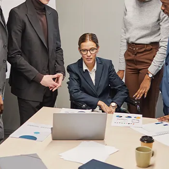 Woman sitting while everyone standing