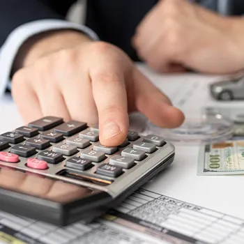 Using a calculator on an office table