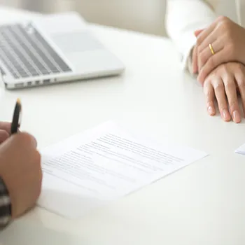 An LLC owner signing a business partnership contract