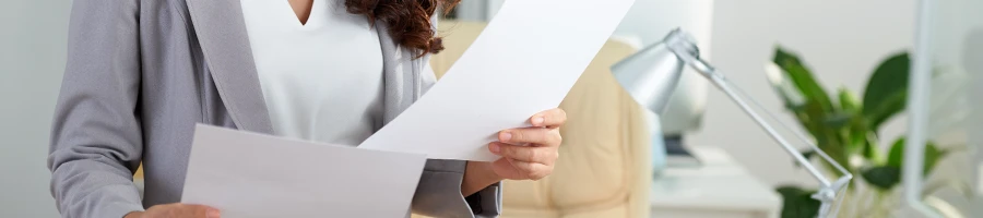 Woman reading document on how to convert an LLC to a non-profit organization