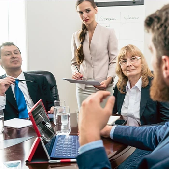 In the middle of the meeting where a young manager explaining to his older co-leagues