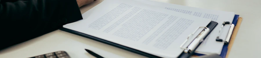 Files on clipboard laying on the table