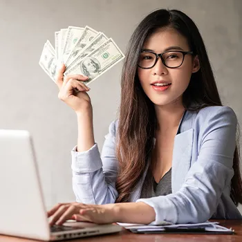 A woman holding a sum of money as LLC expenses that she can write off