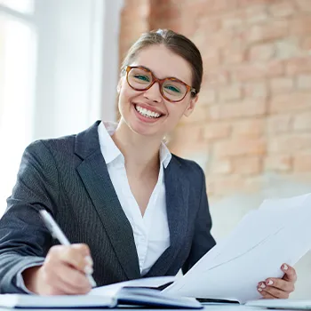 A female accountant smiling in front of the camera