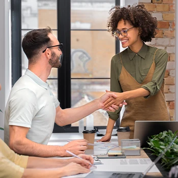 Shaking hands with someone as a sign of agreement