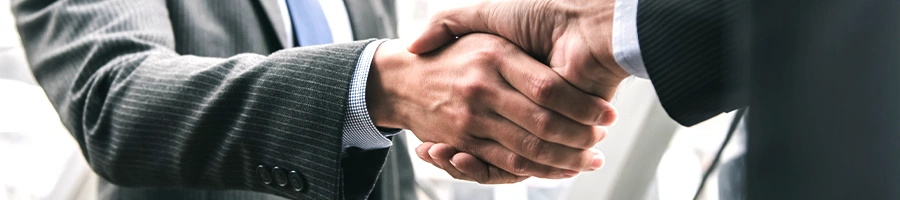 Shaking hands between two businessman as a sign of agreement