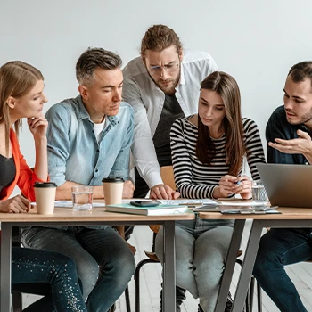 A meeting being held inside the office about how to dissolve an llc in minnesota