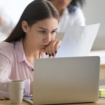 Woman busy looking at laptop