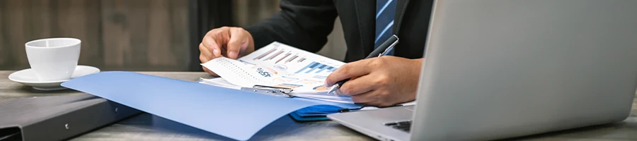 A man writing a Virginia Operating agreement