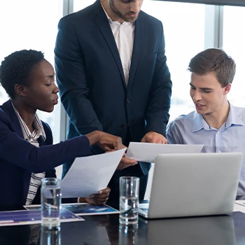 A group of employees discussing Delaware series LLC